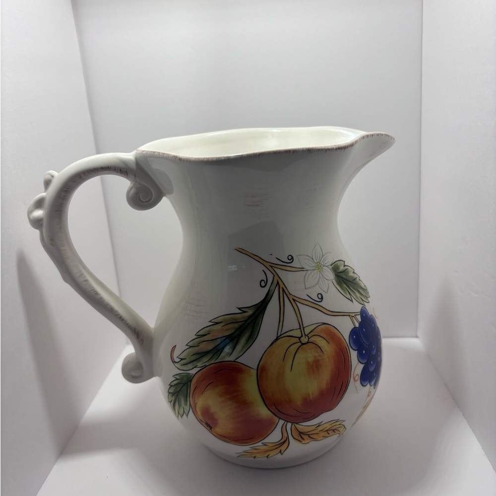 White and Orange Ceramic Art with Fruit Motifs